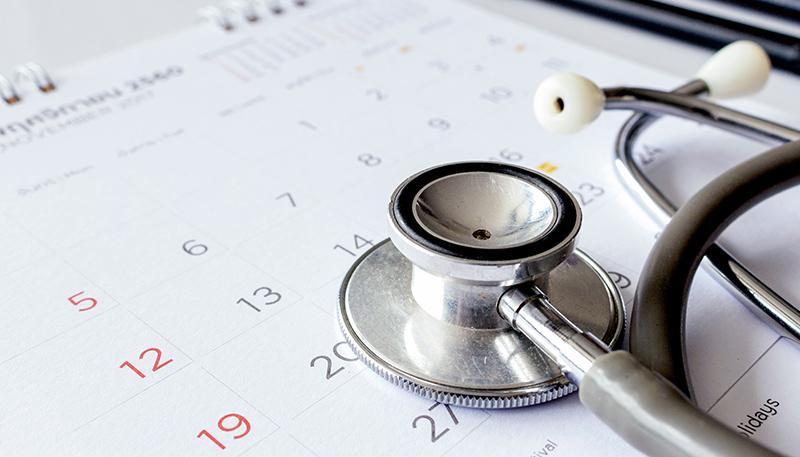 annual checkup concept. stethoscope on the calendar with soft-focus and over light in the background